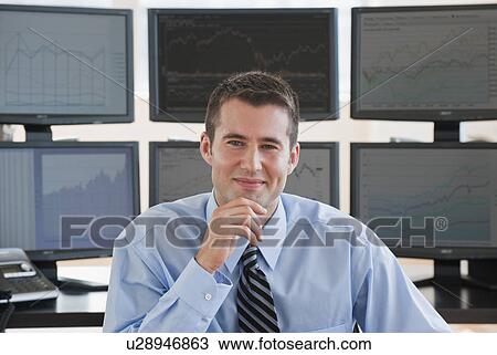 Male trader at work View Large Photo Image Stock Image - Male trader at work. Fotosearch