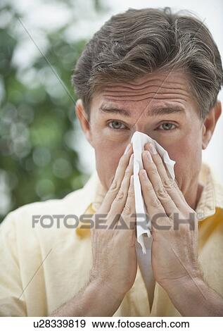 Stock Photo - Man blowing nose. Fotosearch