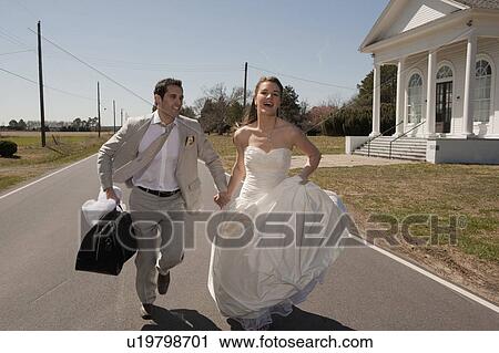 Married couple running View Large Photo Image Stock Image - Married couple running. Fotosearch