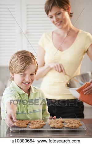Picture - Mother and child baking. Fotosearch