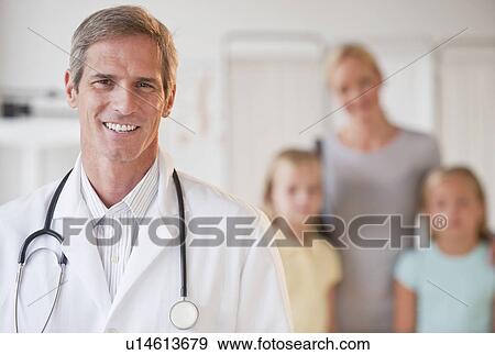 Stock Photo - Mother and daughters at Doctor's office. Fotosearch