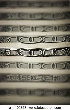 Stock Image - One hundred dollar bills. Fotosearch