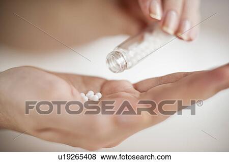 Stock Photo - Pills in hand. Fotosearch