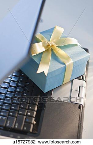 Present on laptop View Large Photo Image Stock Image - Present on laptop. Fotosearch