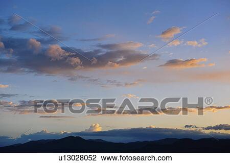 Stock Image - Scenic sky at dusk. Fotosearch