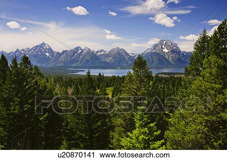 Stock Image - Scenic view of mountains and river. Fotosearch