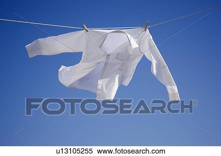 Shirt on clothes line View Large Photo Image Stock Photography - Shirt on clothes line. Fotosearch
