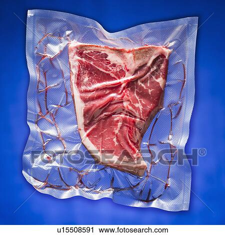 Stock Image - Shrink wrapped steak. Fotosearch