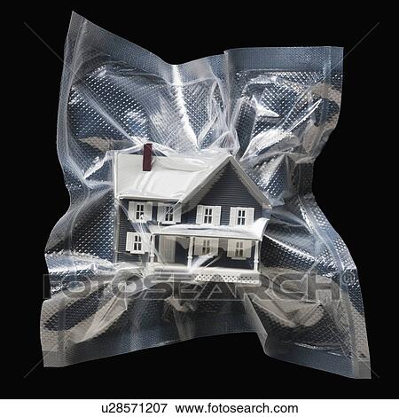 Shrink wrapped toy house View Large Photo Image Stock Photo - Shrink wrapped toy house. Fotosearch