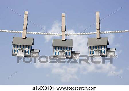 Symbolic houses on clothes line View Large Photo Image Stock Image - Symbolic houses on clothes line. Fotosearch