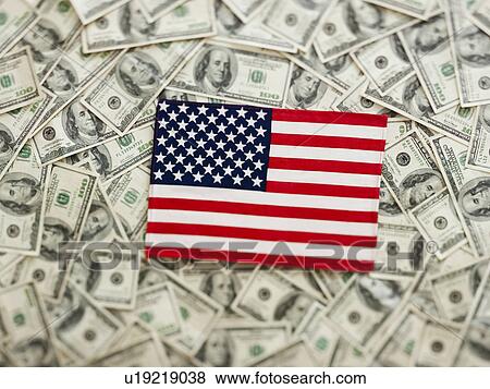 Stock Photo - Symbolic US Flag wtih US dollars as background. Fotosearch