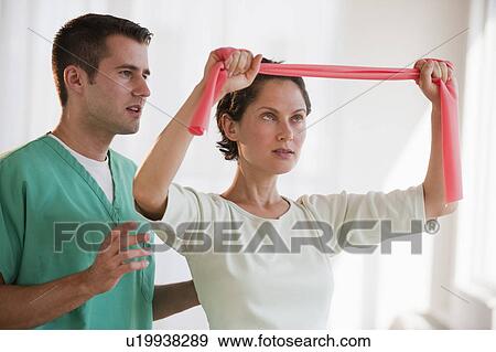 Stock Photo - Therapist and patient. Fotosearch