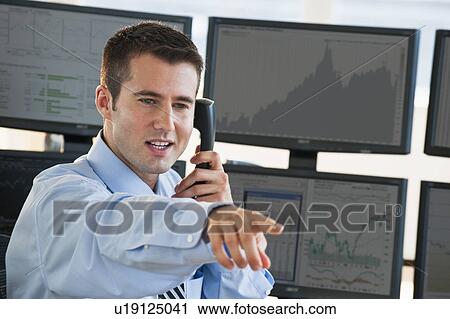 Trader at on phone View Large Photo Image Stock Image - Trader at on phone. Fotosearch