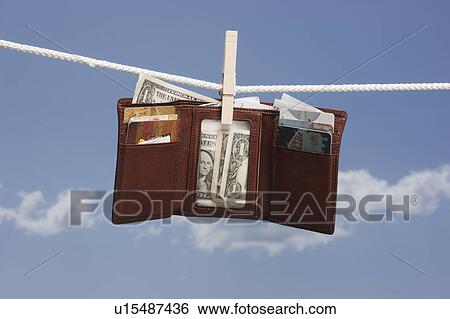 Wallet on clothes line View Large Photo Image Stock Photograph - Wallet on clothes line. Fotosearch