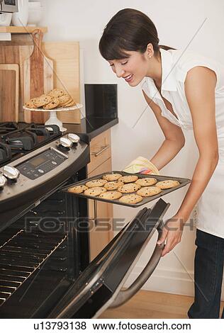 Stock Photo - Woman baking. Fotosearch