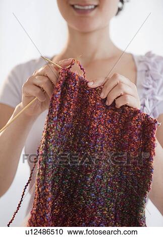 Stock Image - Woman knitting. Fotosearch