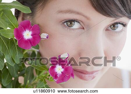 Stock Image - Woman looking into camera. Fotosearch