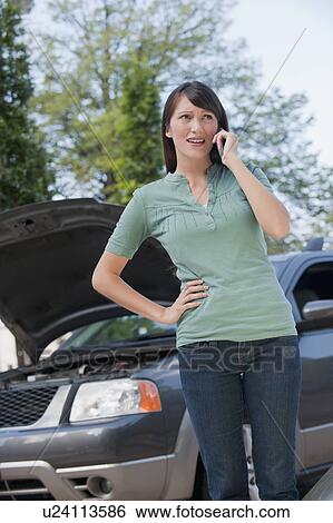 Stock Photograph - Woman on mobile phone. Fotosearch
