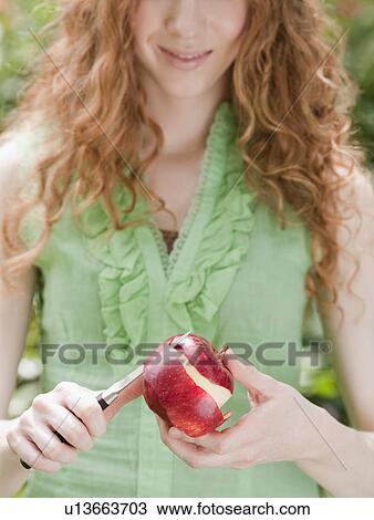 Woman peeling apple View Large Photo Image Stock Image - Woman peeling apple. Fotosearch