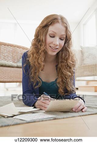 Stock Image - Woman reading mail. Fotosearch