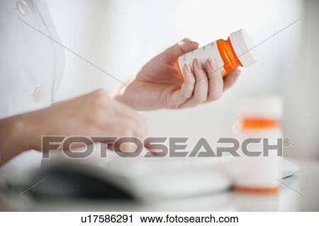 Woman reading medical label View Large Photo Image Stock Image - Woman reading medical label. Fotosearch