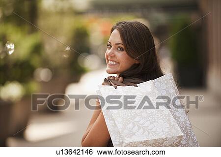 Stock Photograph - Woman shopping. Fotosearch