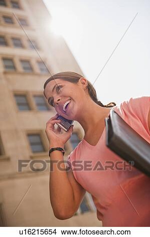 Woman talking on mobile View Large Photo Image Picture - Woman talking on mobile. Fotosearch