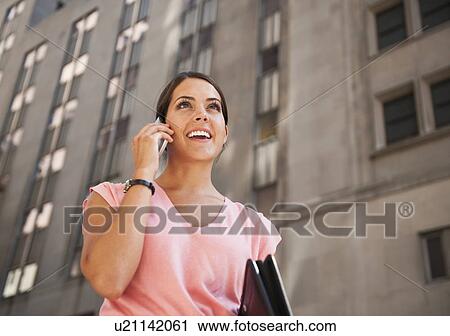 Woman talking on mobile View Large Photo Image Stock Image - Woman talking on mobile. Fotosearch