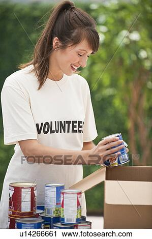 Woman volunteering View Large Photo Image Stock Image - Woman volunteering. Fotosearch