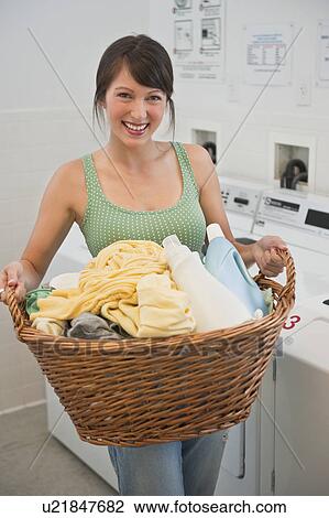 Stock Image - Woman washing clothes. Fotosearch