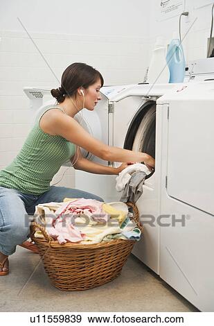 Stock Photo - Woman washing clothes. Fotosearch