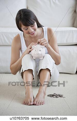 Woman with piggy bank View Large Photo Image Stock Photography - Woman with piggy bank. Fotosearch