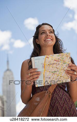 Woman with tourist map View Large Photo Image Stock Image - Woman with tourist map. Fotosearch