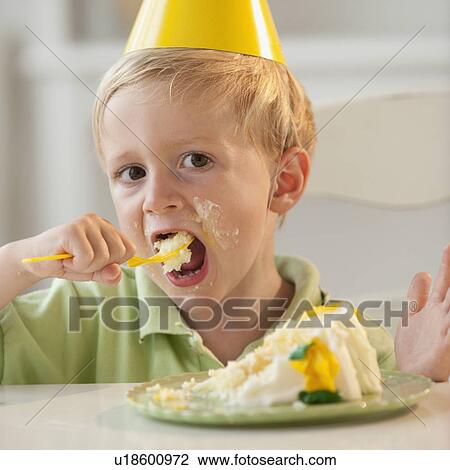 Young child eating birthday cake View Large Photo Image Stock Image - Young child eating birthday cake. Fotosearch