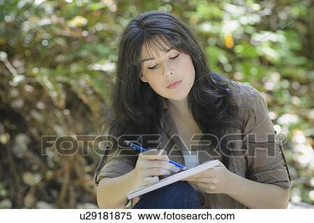 Young female sketching View Large Photo Image Stock Photography - Young female sketching. Fotosearch