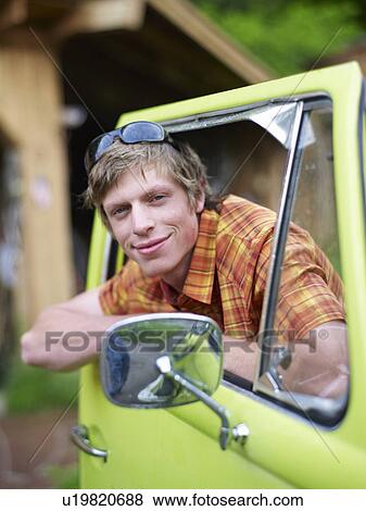 Stock Photo - Young man in truck. Fotosearch