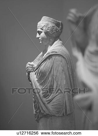 Stock Photograph - Ancient statue in Katakolon. Fotosearch