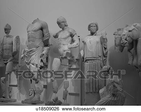 Stock Photograph - Ancient statues in Katakolon. Fotosearch