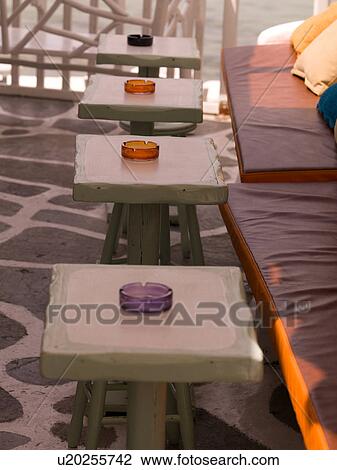 Stock Image - Banquette and tables in Mykonos Greece. Fotosearch