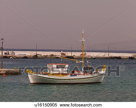 Stock Photography - Boat off shoreline of Mykonos Greece. Fotosearch