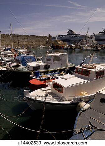 Boats in Mandraki Harbour in Rhodes Greece View Large Photo Image Stock Photo - Boats in Mandraki Harbour in Rhodes Greece. Fotosearch