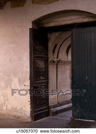 Stock Image - Carved door in Naples. Fotosearch