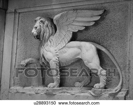 Stock Image - Carving of a winged lion in Venice. Fotosearch