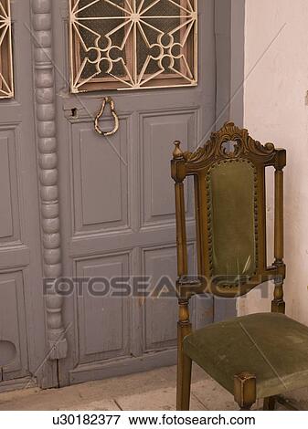Chair outside doorway in Kusadasi Turkey View Large Photo Image Stock Photo - Chair outside doorway in Kusadasi Turkey. Fotosearch