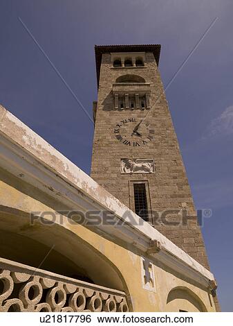 Clock tower at Mandraki Harbour in Rhodes Greece View Large Photo Image Stock Photograph - Clock tower at Mandraki Harbour in Rhodes Greece. Fotosearch