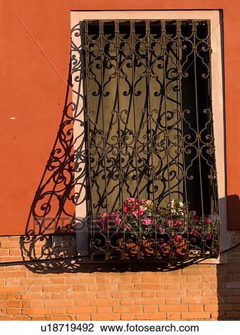 Stock Image - Decorative bars on window in Venice. Fotosearch