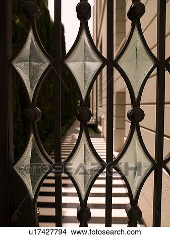 Picture - Diamond shape glass on a gate in Athens Greece. Fotosearch