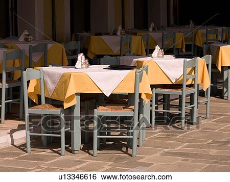 Empty chairs at ourdoor café in Katakolon View Large Photo Image Stock Photograph - Empty chairs at ourdoor café in Katakolon. Fotosearch
