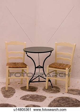Empty table and chairs in Mykonos Greece View Large Photo Image Stock Image - Empty table and chairs in Mykonos Greece. Fotosearch