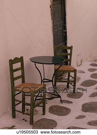 Empty table and chairs in Mykonos Greece View Large Photo Image Stock Image - Empty table and chairs in Mykonos Greece. Fotosearch